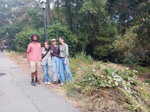 Interns and a pile of weeds