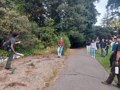 Interns Andrew and Alessandra speaking to students