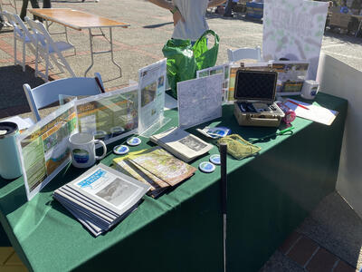 Table with brochures, signs and other Strawberry Creek supplies